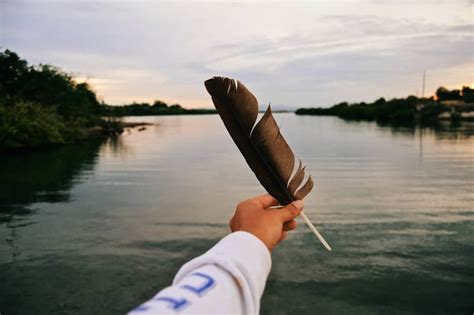 meaning of two feathers tied together|two black feathers meaning.